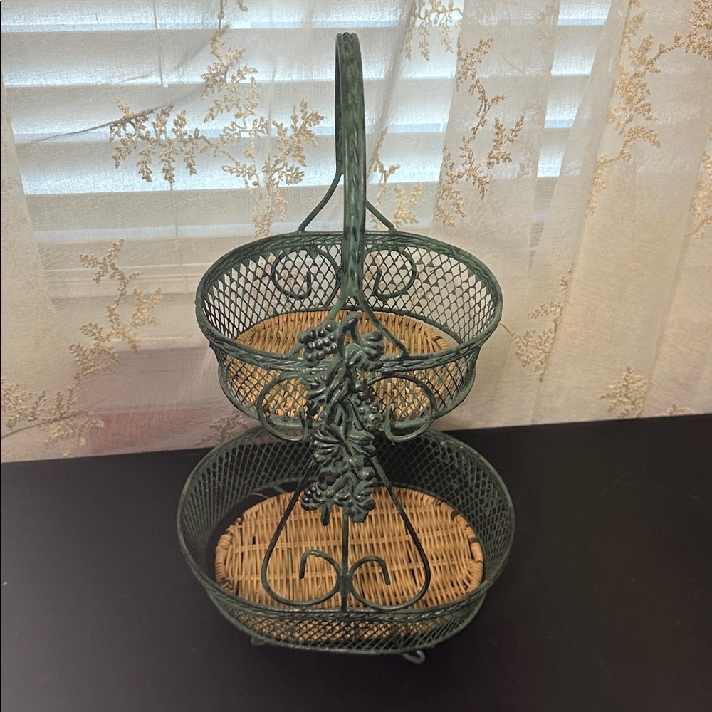 Wire Basket stand made of green-painted metal wire with a woven wicker base